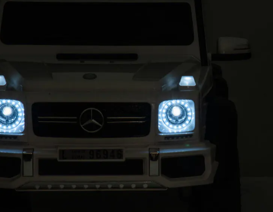 Kinder Elektroauto Mercedes G63 AMG 6x6 lizenziert - EVA+Leder+LED, 4 Motoren